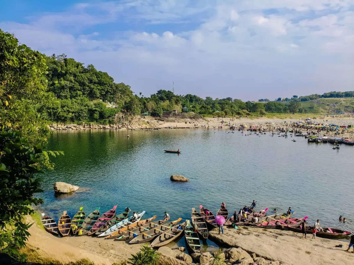 Wooden boats pulled up on the bank of the Umngot river at Dawki